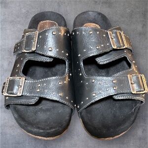 Freebird “Asher” black studded leather sandals with buckle accents. Size 9.